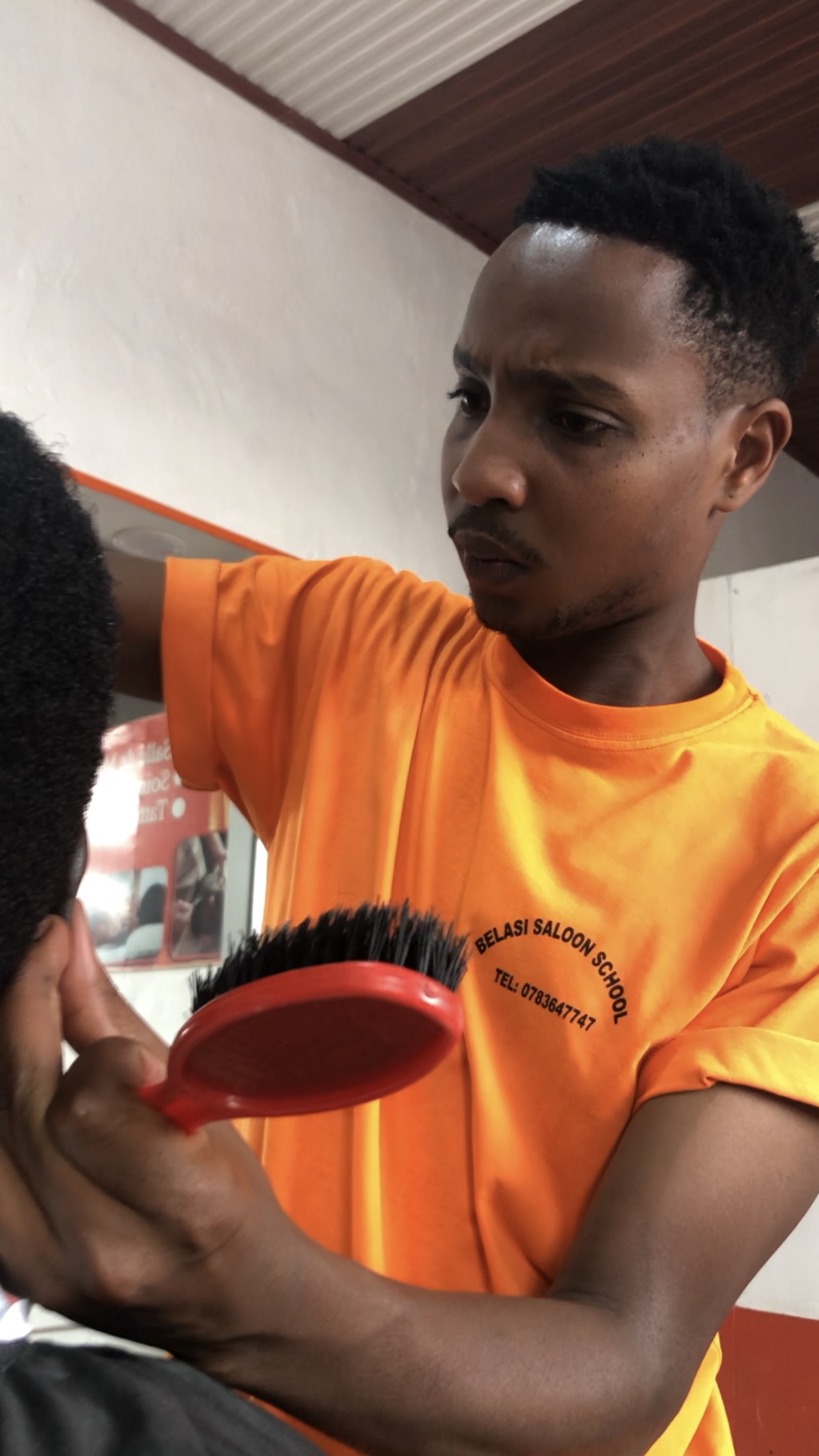 Students and teacher at Belasi Saloon School Rwanda learning and practicing beauty and TVET skills under the guidance of Epiphanie MUKAYIRANGA.