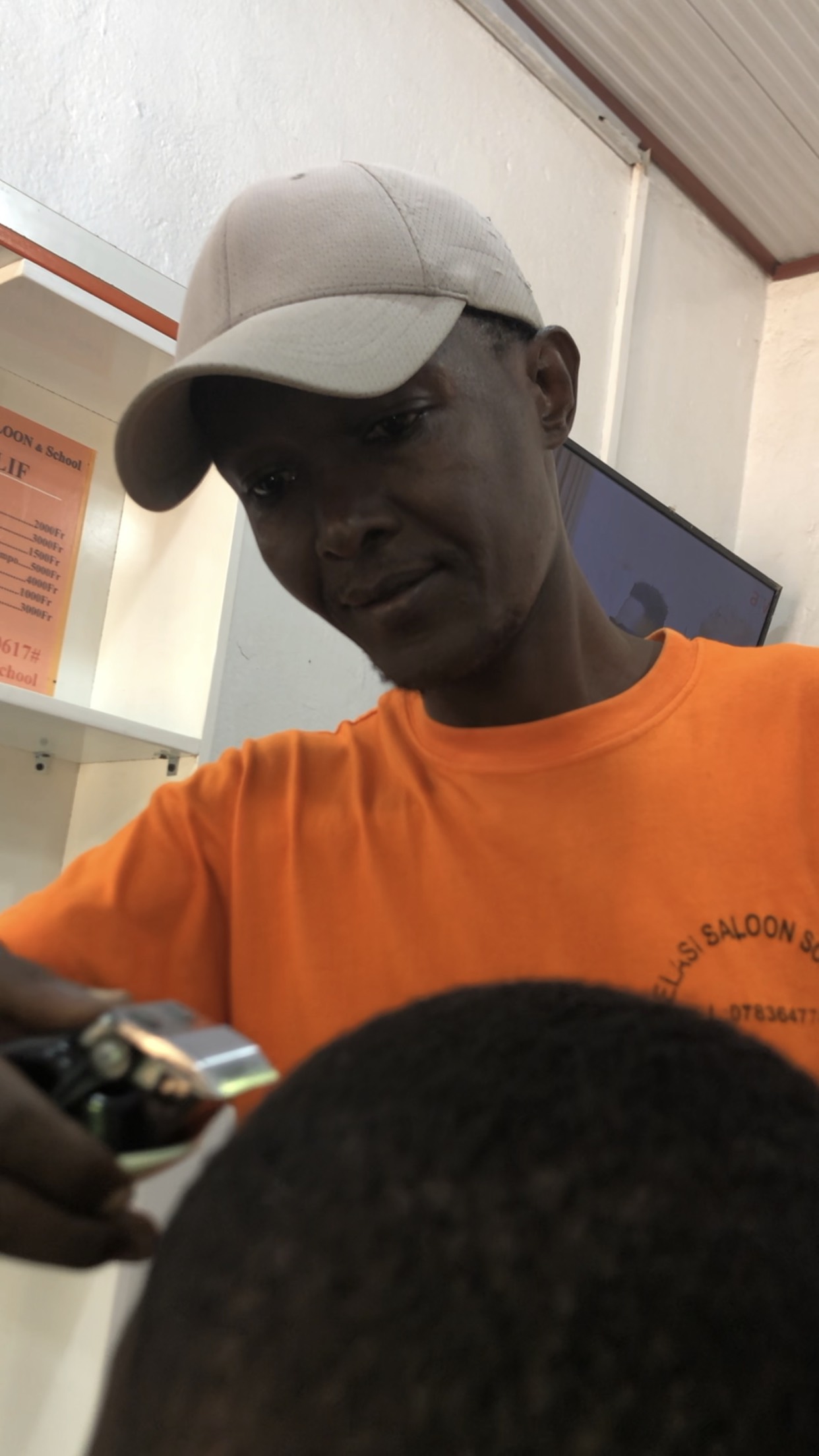 Students and teacher at Belasi Saloon School Rwanda learning and practicing beauty and TVET skills under the guidance of Epiphanie MUKAYIRANGA.