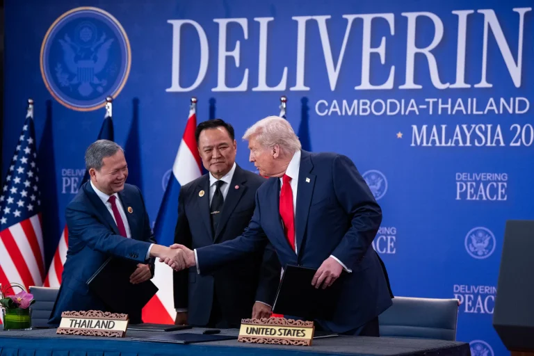 President Trump standing with Cambodian Prime Minister Hun Manet and Thai Prime Minister Anutin Charnvirakul at a diplomatic meeting in Asia.