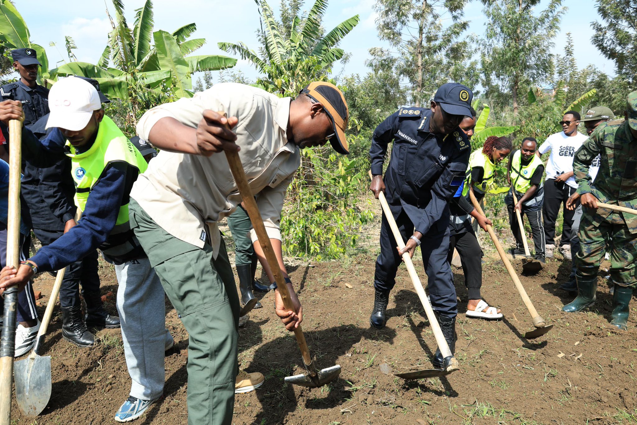 Health Minister Dr. Sabin Nsanzimana and Inspector General of Police CG Felix Namuhoranye with Rwanda Defence Force security forces and youth during a community Umuganda event focused on the campaign against drug abuse and illicit alcohol in Rwanda.